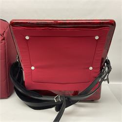 Hsinghai Studio piano accordion with red pearline finish, twenty keys and seventy-two buttons W44cm; in hard carrying case with additional The Music Room soft gig case