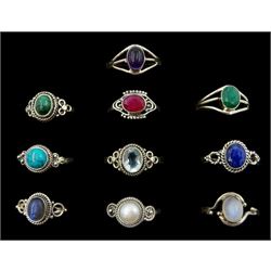 Ten silver stone set rings including turquoise, malachite, mother of pearl, blue topaz and amethyst