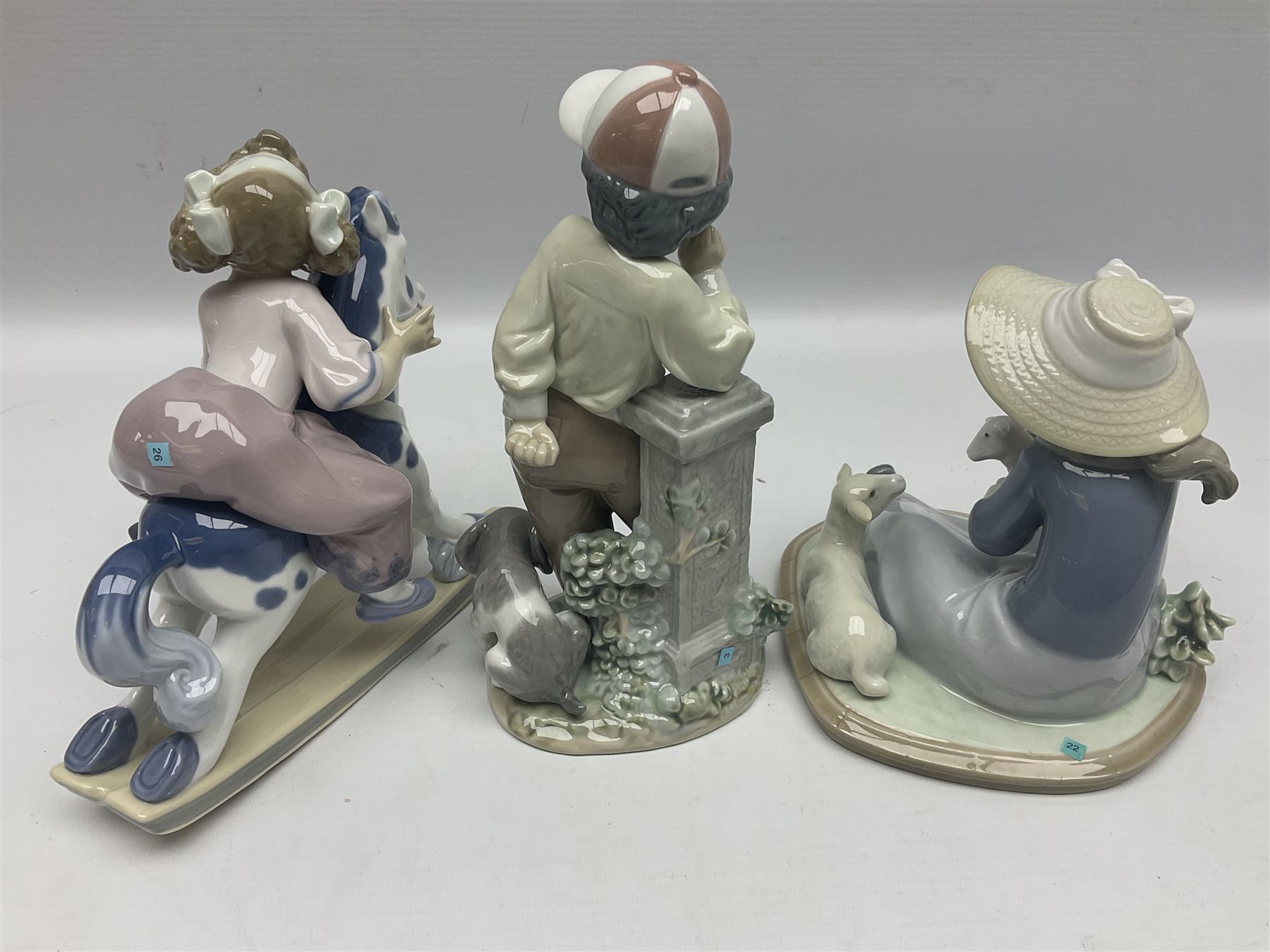 Three Lladro figures, Faithful Steed no 5769, Best Foot Forward no 5738 and Lambkins no 5469, all with original boxes, largest example H21cm 