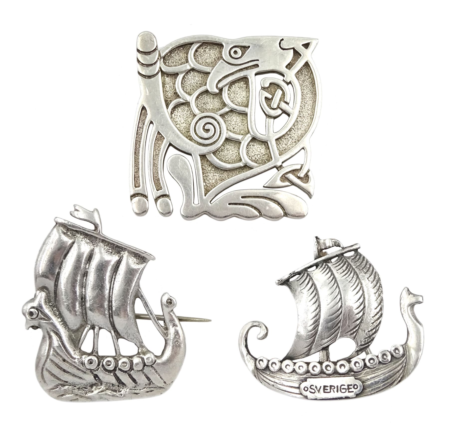 Swedish silver Viking ship brooch by G. Dahlgren & Co, Scottish silver Viking ship brooch by Iain MacCormick, Iona and a Scottish silver Celtic bird pendant, makers mark ADM, Edinburgh 2005