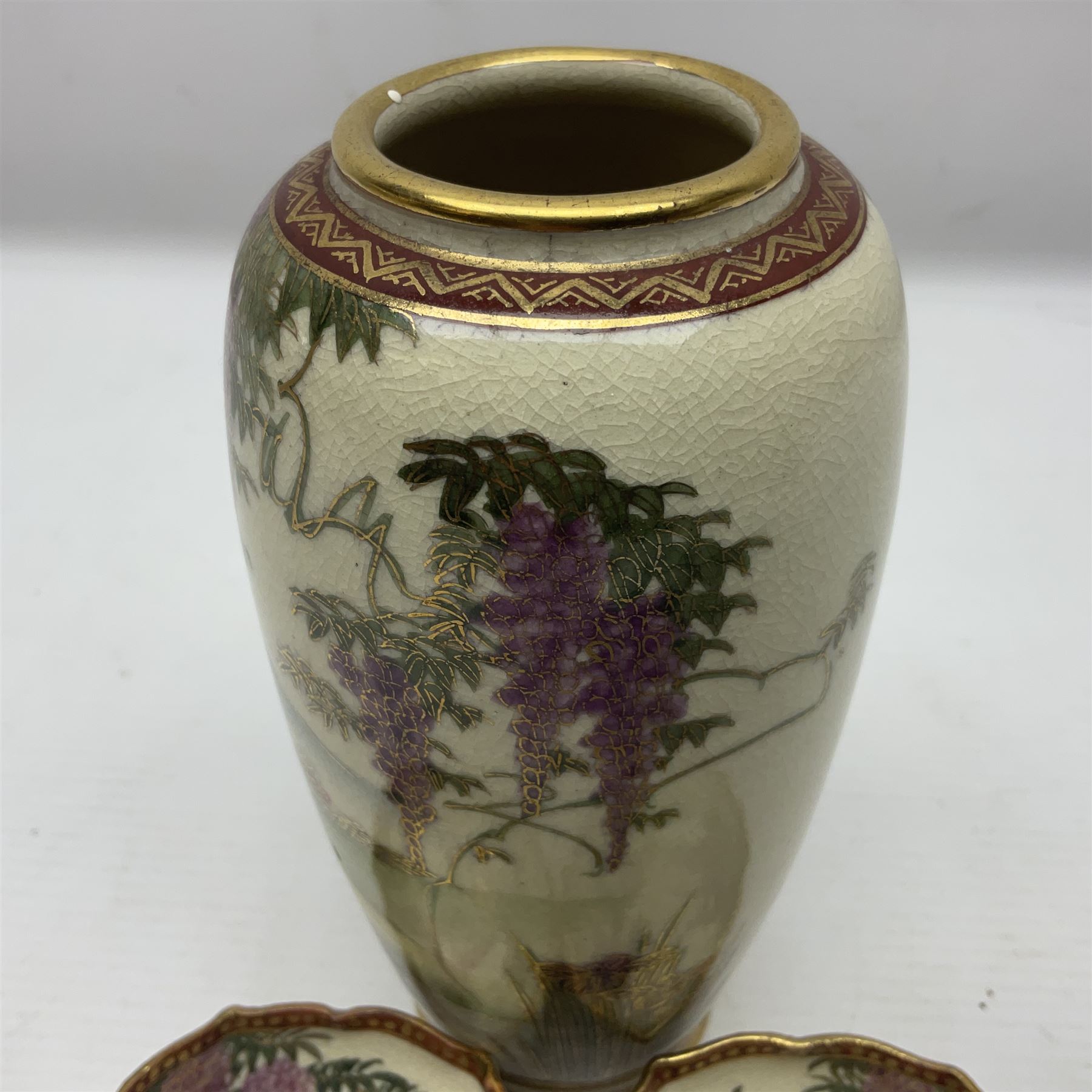 Japanese Satsuma Meiji period vase painted with a mountainous river landscape scene with wisteria and irises; together with a pair of similarly painted small dishes, signature beneath, vase H15cm
