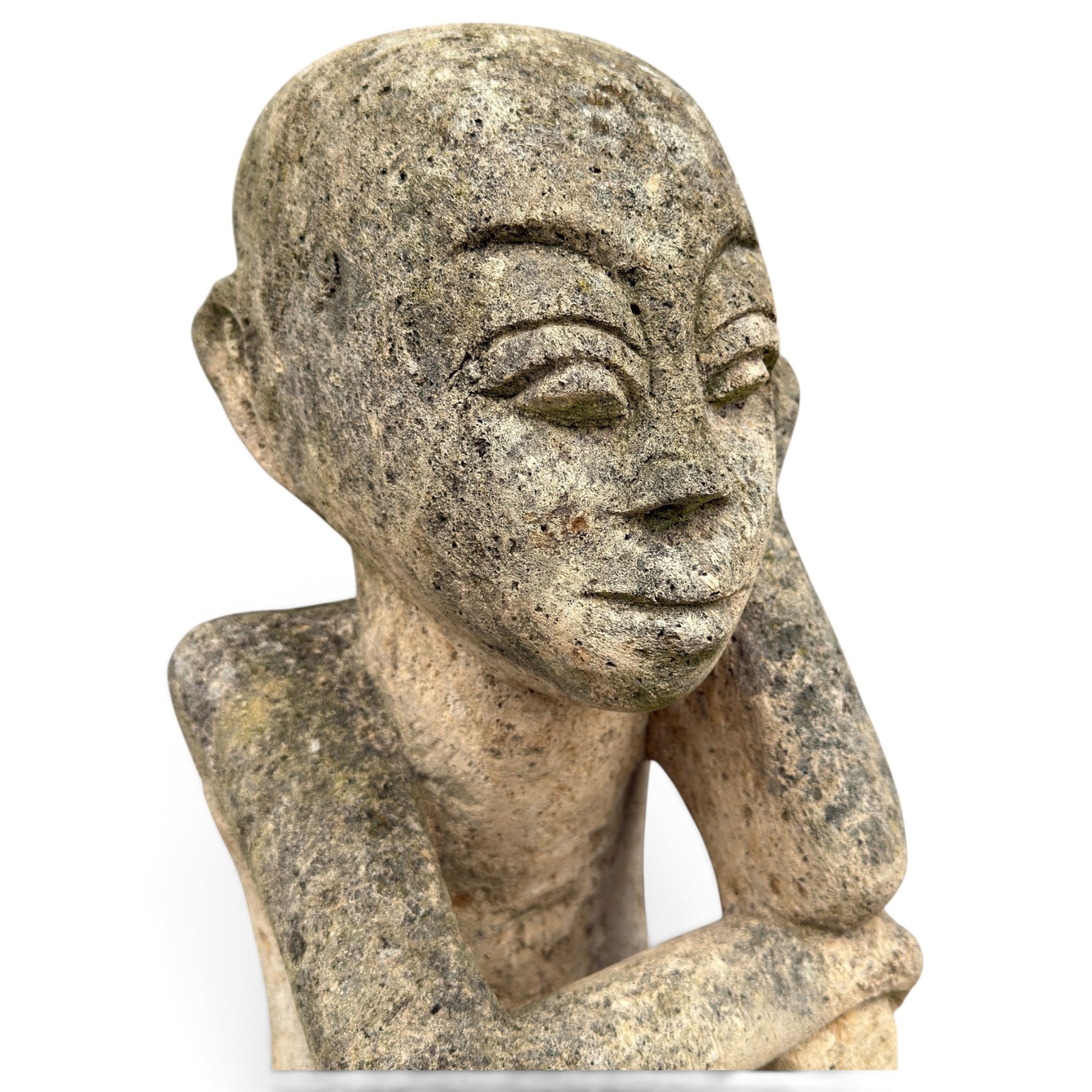 Balinese design weathered cast stone figure of an ancestral guardian, modelled in a squatting pose 