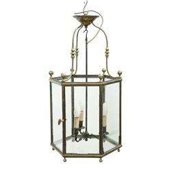 Early 20th-century Georgian design brass hanging hall lantern, hexagonal form with scrolli...