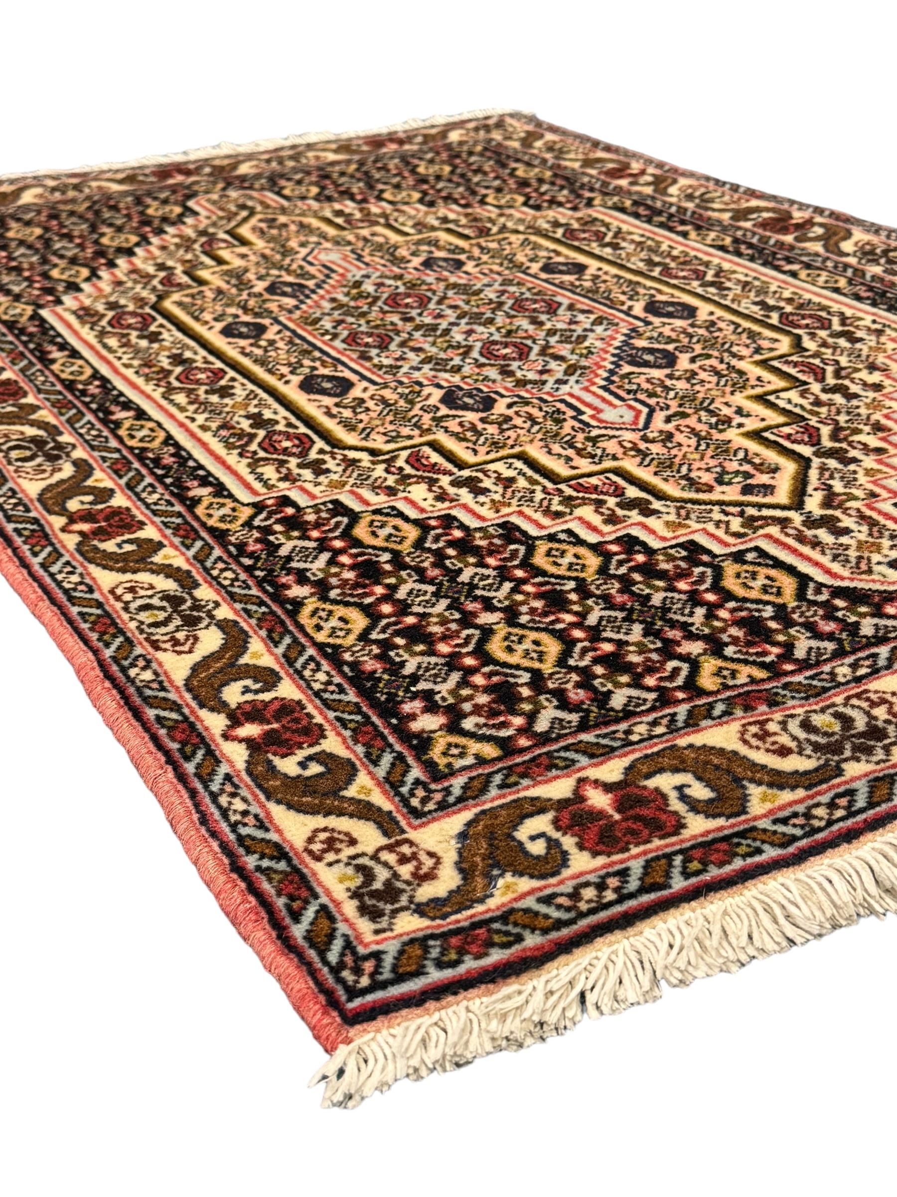 Small Persian Bidjar rug, the field decorated with floral Herati motifs, within floral design borders and guard stipes 