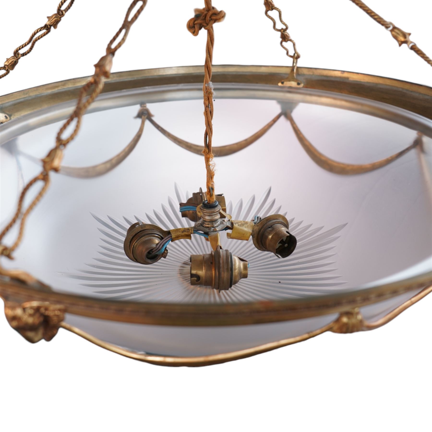Late 20th century gilt metal ceiling light, circular form decorated with rams heads and swags, frosted glass bowl with bevelled decoration (D51cm); together with another late 20th century gilt metal ceiling ight, decorated with ribbons and rams heads with laurel swags, moulded glass bowl (D32cm)