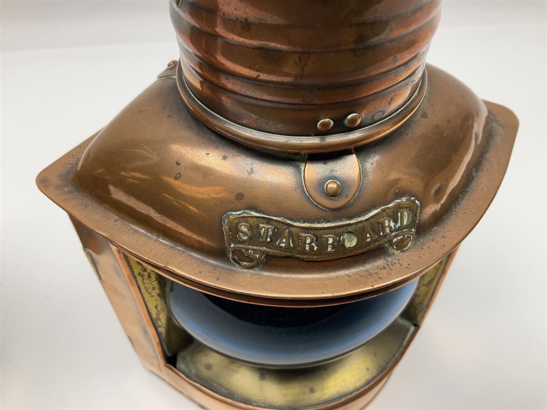 Pair of ‘Starboard’ and ‘Port’ copper ship lamps, of bow-fronted triangular form, H21cm