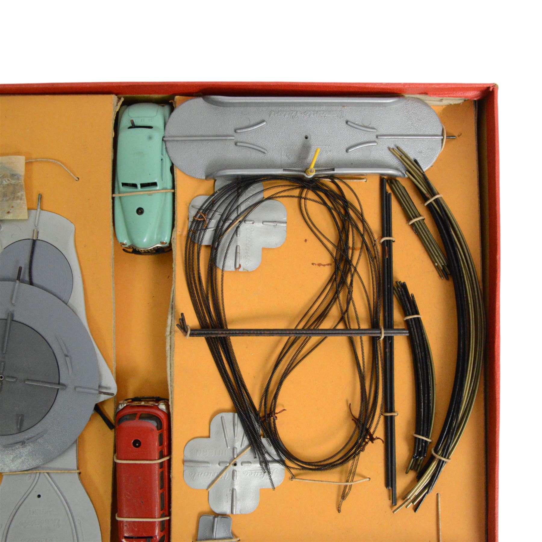 Schuco Varianto 3010 F boxed set, comprising two tinplate vehicles 3044 Varianto-Bus and 3041 Varianto-Limo, road sections, guidewires and signs, boxed