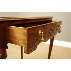  20th century mahogany writing table, moulded top with inset tooled leather top, single frieze drawer, on cabriole legs with shell carved knees, labelled and lock stamped for 'Waring & Gillows Ltd Lancaster', W77cm, H73cm, D50cm   