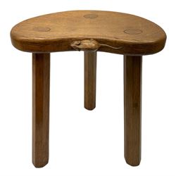 'Mouseman' oak three-legged stool, kidney shaped dished seat with carved mouse signature to edge, by Robert Thompson of Kilburn