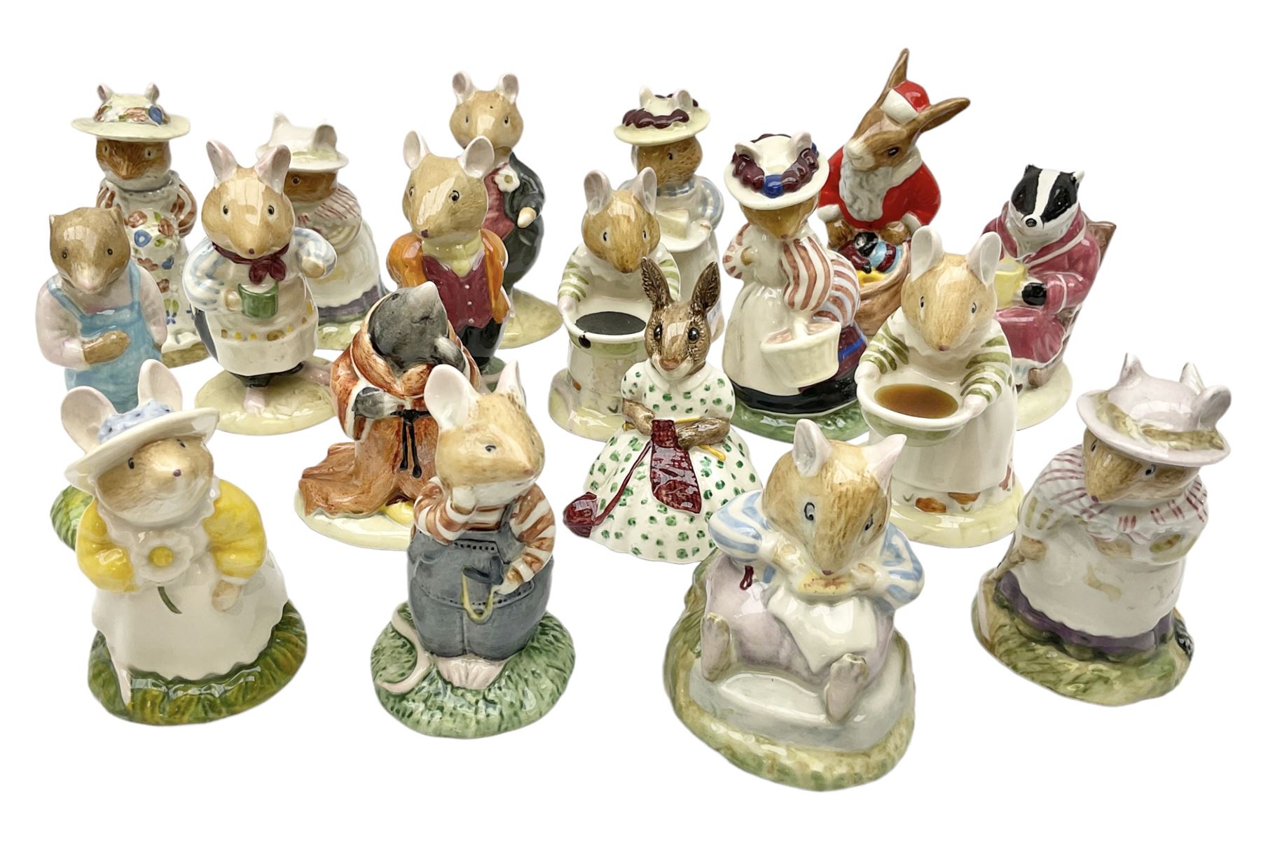 Fifteen Royal Doulton Brambly Hedge figures, comprising Wilfred Toadflax, Dusty Dogwood, Mrs Toadflax, Mr Apple, Primrose Woodmouse, Lord Woodmouse, Poppy Everbright, two Lady Woodmouse, two Old Mrs Everbright, Mr Toadflax, Mrs Apple, Santa Bunnykins and Bunnykins, together with three Royal Albert Wind in the Willows figures comprising Ratty, Badger and Mole, all with printed marks beneath (18)