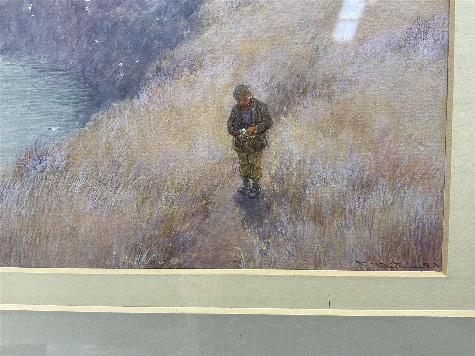 John White (Scottish 1851-1933): A Boy on a Coastal Path, watercolour and gouache signed 17.5cm x 28.5cm 