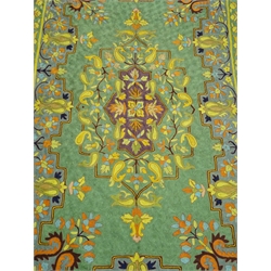  An Iranian lined silk tapestry wall hanging, the central oblong panel with floral motif in purple, yellow, green, orange and blue on a green ground within a stepped blue ground border of stylised motifs and two conforming outer borders W113cm L188cm Provenance: This lot was gifted to the vendor who worked for the Royal Family of Oman  