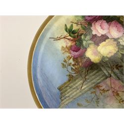 19th century porcelain stand, of circular form, in the Derby style, hand painted with a ruinous column and roses against a landscape background, within a gilt border, D7cm