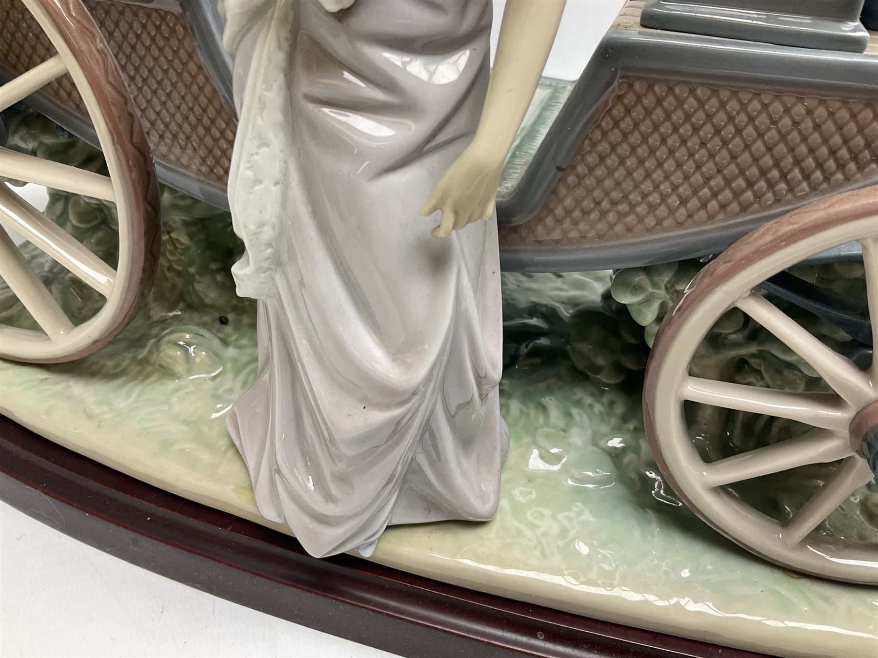 Large Lladro figure, The Landau Carriage, modelled as a horse drawn open top carriage, on a mahogany base, no 1521, sculpted by Juan Huerta, year issued 1987, year retired 1998, H30cm 