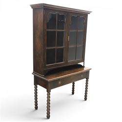 Early 20th century Jacobean Revival dark stained oak dresser, the associated upper section...