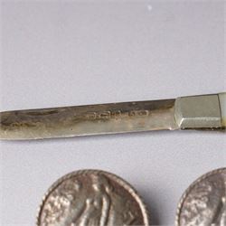 Five late Victorian silver buttons with a raised pattern of a female figure Birmingham 1900 Maker Laurence Emanuel and a silver bladed and mother of pearl fruit knife