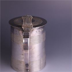George III silver lidded tankard, with two ribbed bands to the cylindrical body, the hinged lid with concentric circle to cover and pierced thumbpiece, hallmarked Charles Fox I, London 1816, including thumb piece H16cm