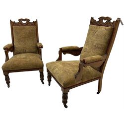 Pair of late Victorian oak salon open armchairs, pierced cresting rails carved with scrolling acanthus leaves, on turned feet with brass and ceramic castors
