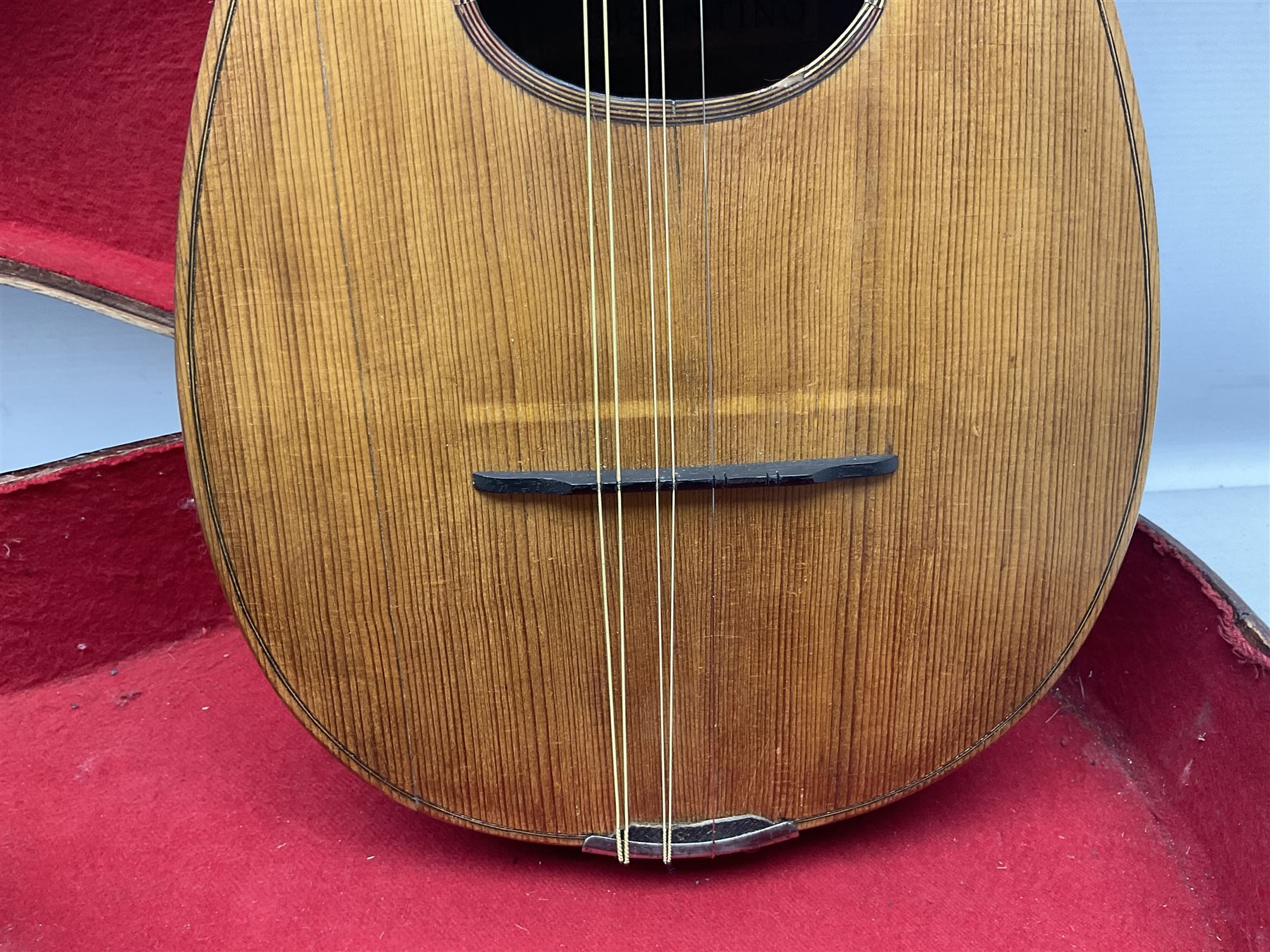 Early 20th century Italian Rafaele Disantino eight-string mandolin with two-piece back and spruce top with stamped Rafaele Disantino signature; bears maker's label L61cm; in wooden carrying case