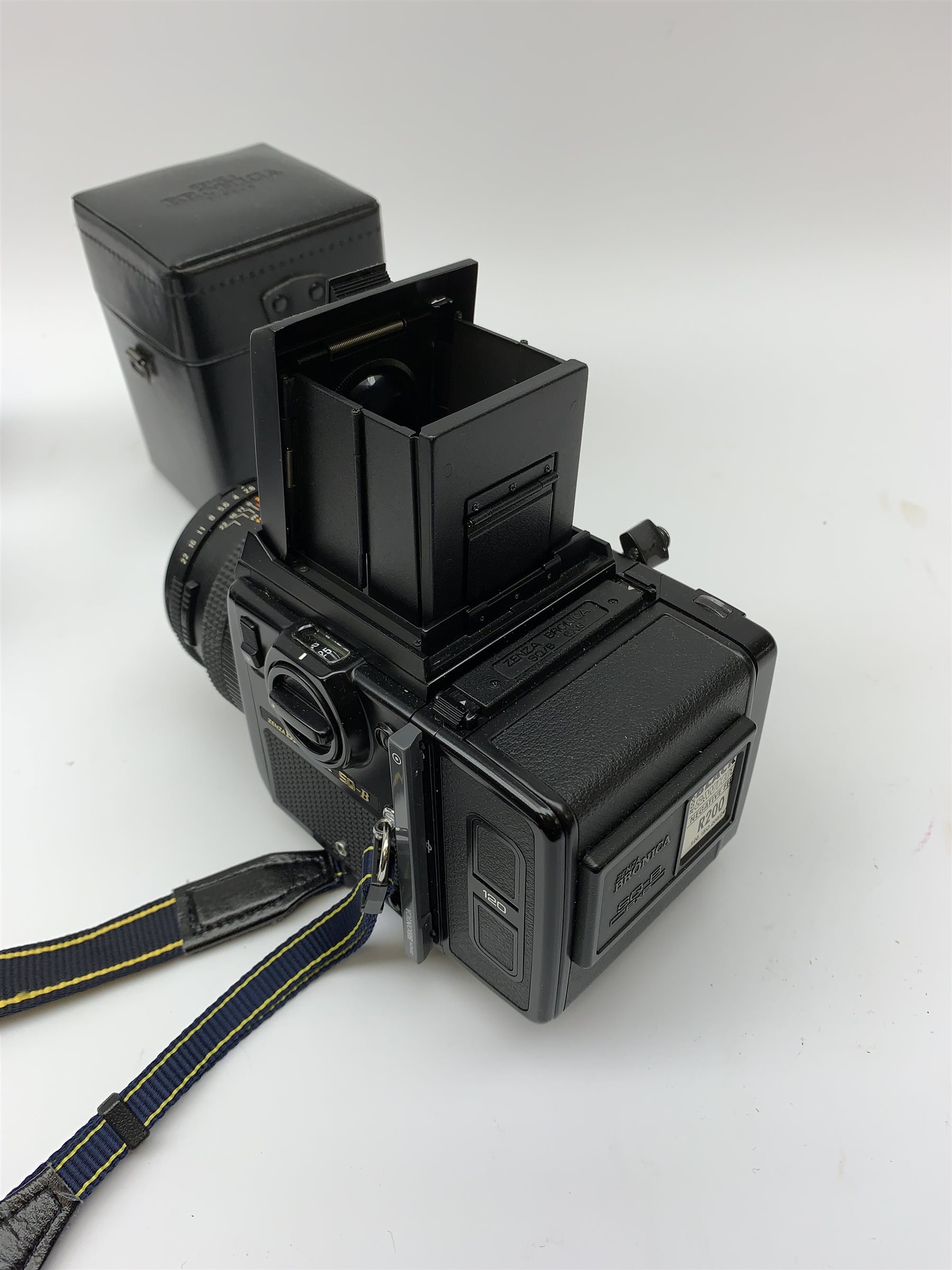 'Zenza Bronica SQ-B' camera fitted with 'Zenza Bronica Zenzanon-PS 1:28 f=80mm' lens, 'Zenza Bronica Zenzanon-PS 1:4 f=150mm' lens and 'Zenza Bronica Zenzanon-S 1:35 f=50mm' lens, with an instruction booklet