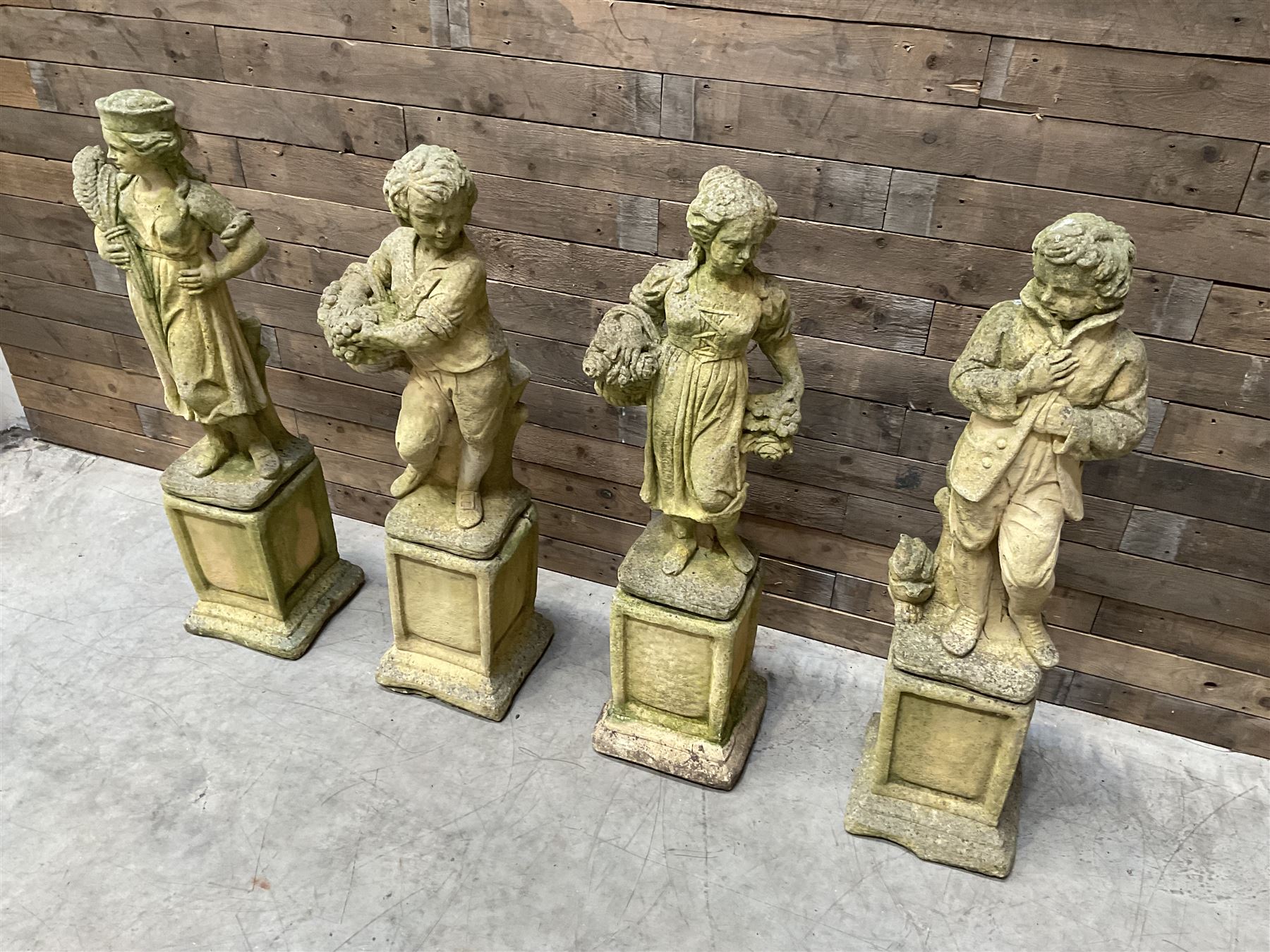 The Four Seasons - set of four cast stone garden figures on plinths