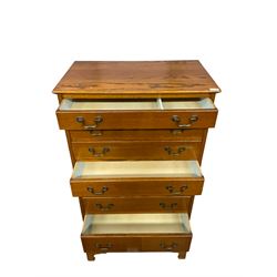 Mid-20th century oak straight-front chest, fitted with eight graduating drawers, raised on bracket feet