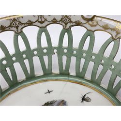 Pair of 19th century German openwork chestnut baskets, with twin handles and scrolling gilt border and star rim, painted to the centre with birds and insects, D22cm 