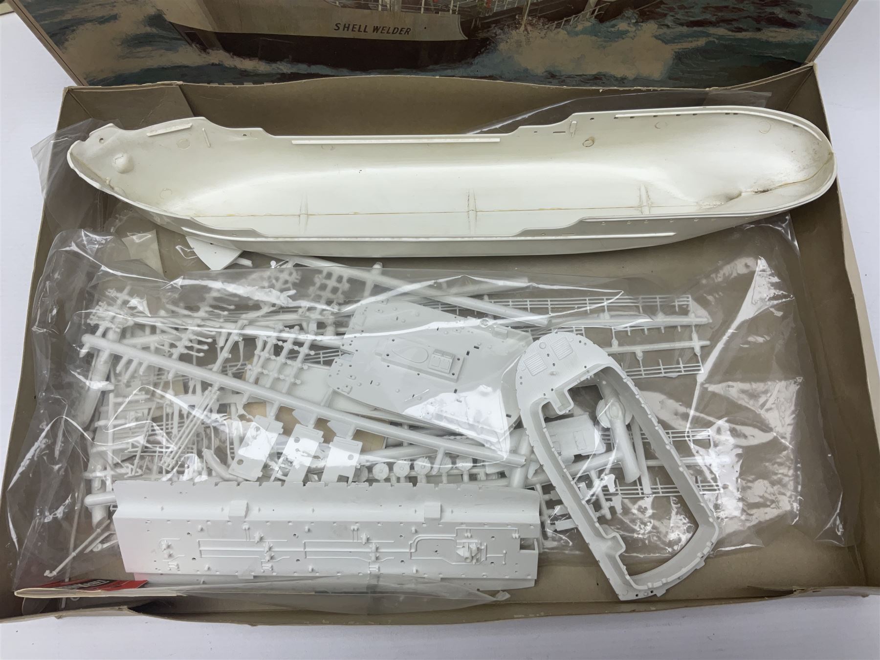 Three unmade construction kits - Airfix 1:24 scale Supermarine Spitfire Mk.1A; predominantly in unopened factory packaging with instructions and decal sheet; Frog Shell Welder with instructions; and Airfix Battle of Waterloo Farmhouse (instructions on box base); all boxed (3)