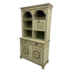 Portuguese painted dresser, two-tier plate rack with spindle gallery and fall-front cupboard, flanked by fluted uprights, fitted with two drawers over two cupboards, the panelled cupboards with floral decoration and a rinceaux border, white painted and parcel-gilt 