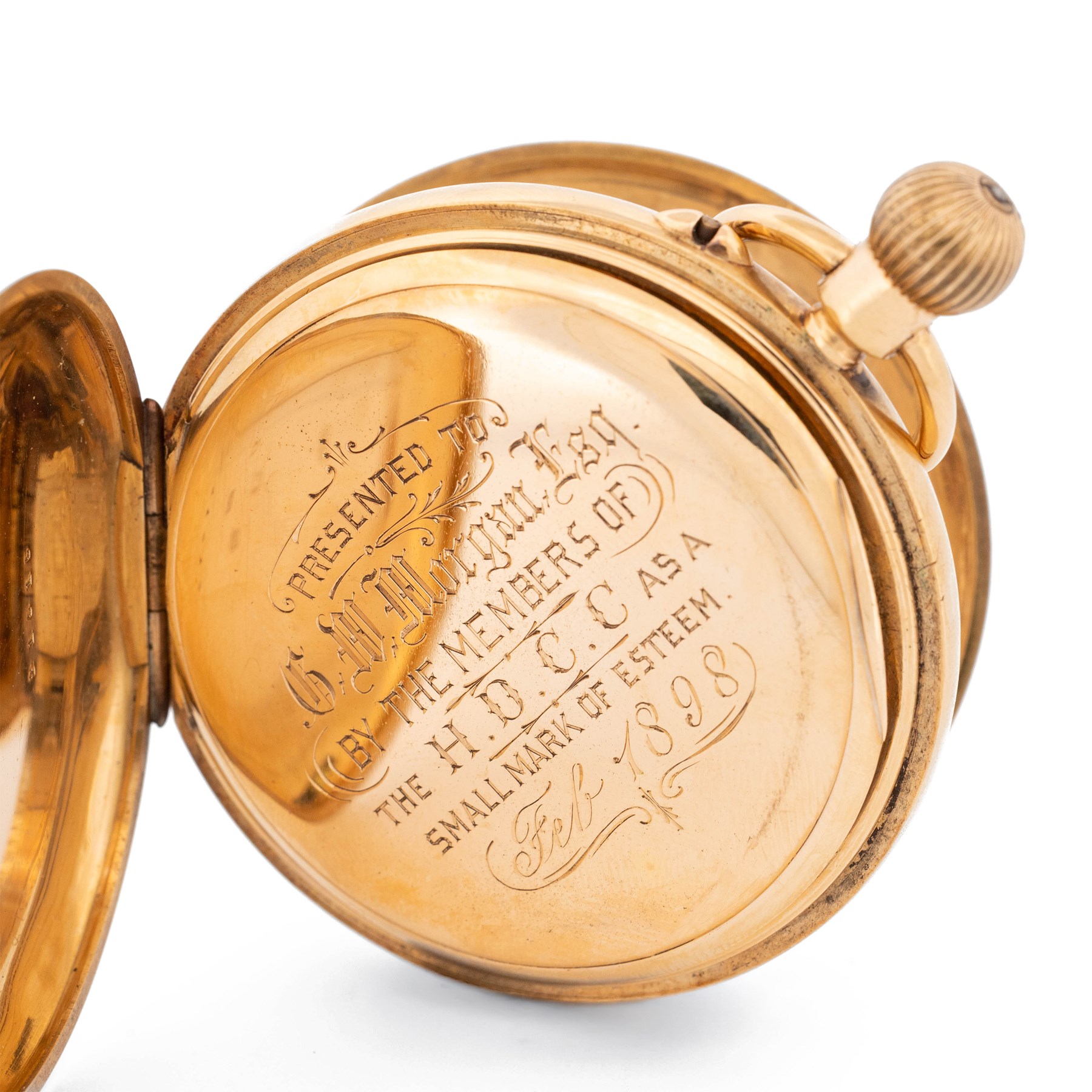 Victorian 18ct gold half hunter keyless lever presentation pocket watch by Lavine Brothers, Johannesburg & London, white enamel dial with Roman numeral hour markers and subsidiary seconds dial, the base case monogrammed with initials, case by Fred Thoms, London 1897