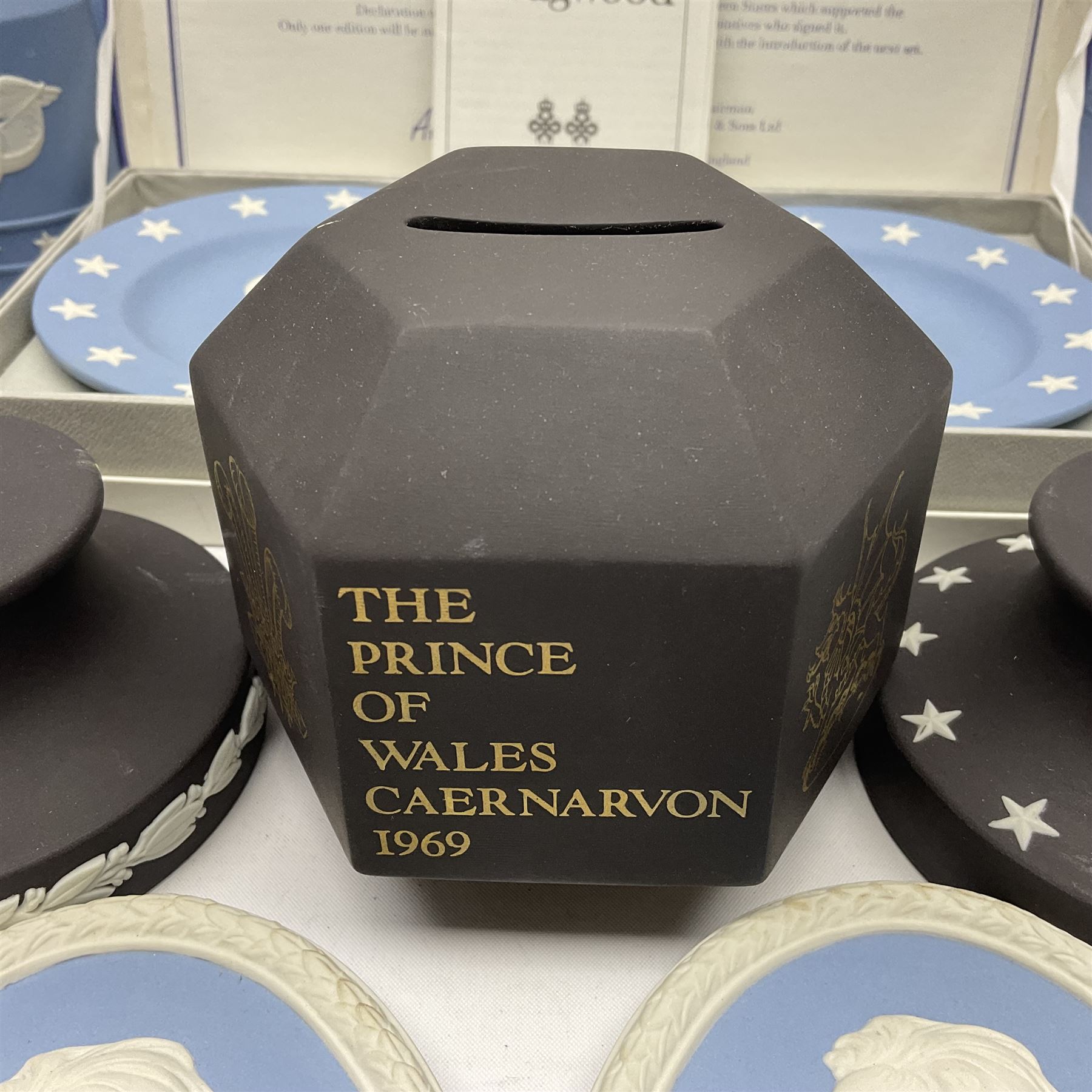 Collection of Wedgwood Jasperware, to include black Eisenhower Bust, two black basalt paperweights, one depicting an eagle and one depicting Julius Caesar, a blue Zodiac plate, Man on the Moon commemorative plate, American Independence Bicentennial plate and Royal commemorative ware, etc, all with impressed marks beneath, some with boxes