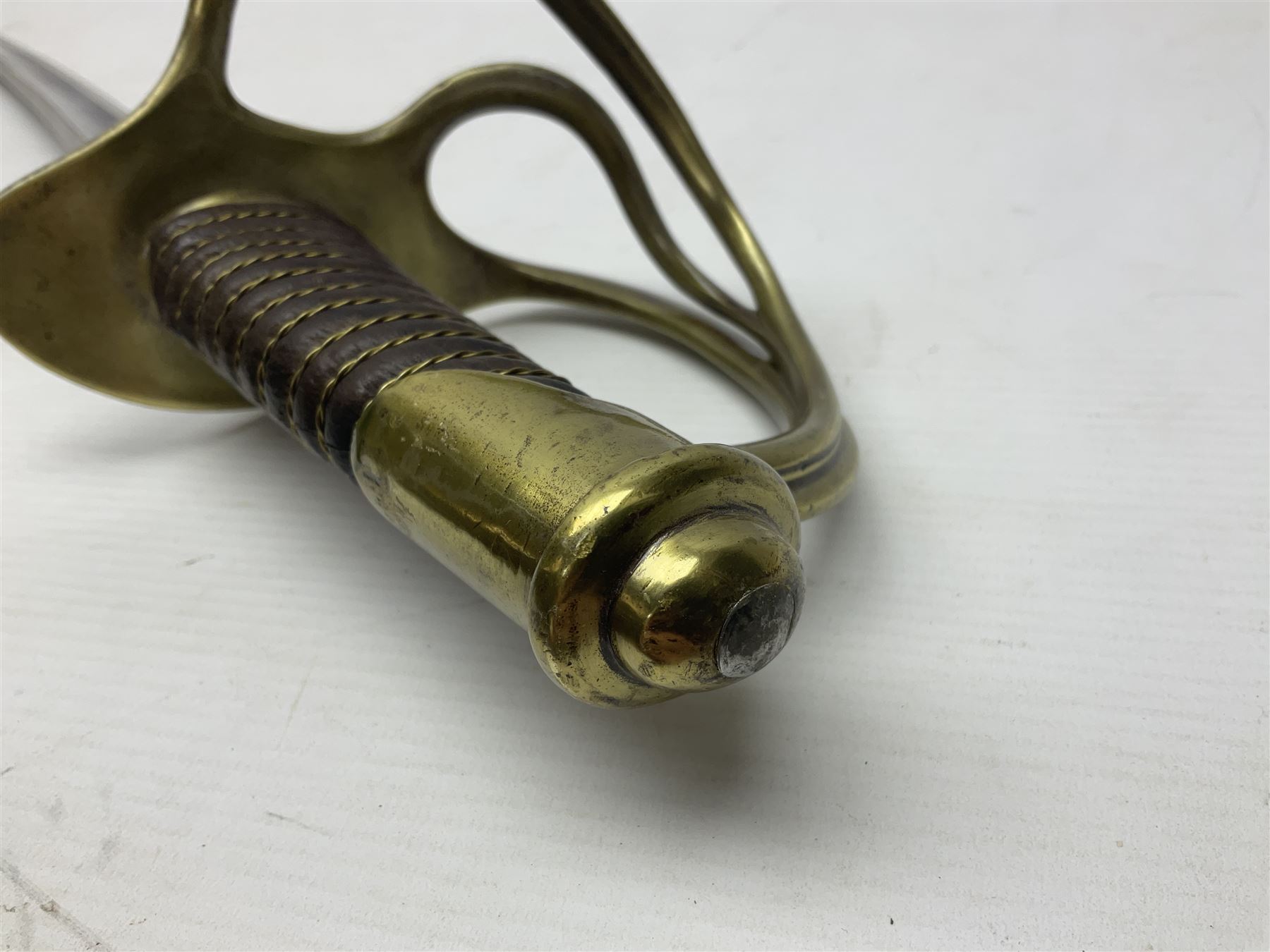 19th century French 1822 Pattern Light Cavalry trooper's sword with 88.5cm slightly curving fullered blade, brass three-bar hilt and wire-bound leather grip; in polished steel scabbard with two suspension rings L110.5cm overall