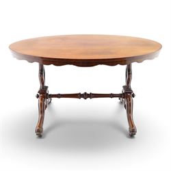 Victorian mahogany breakfast table, oval moulded top over a shaped frieze, on twin pierced...