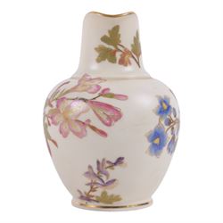 Five Royal Worcester Blush Ivory jugs, comprising one shape 1085 example with bamboo handle, one shape 1376 example with floral decoration and gilt handle and three shape 1094 examples, each decorated with floral sprigs, with printed marks beneath, tallest H14cm
