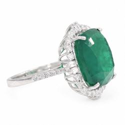 18ct white gold emerald and diamond cluster ring, single cushion cut emerald of approx 13.20 carat, surrounded by round brilliant and baguette cut diamonds and diamond set shoulders, stamped 18K, total diamond weight approx 1.00 carat