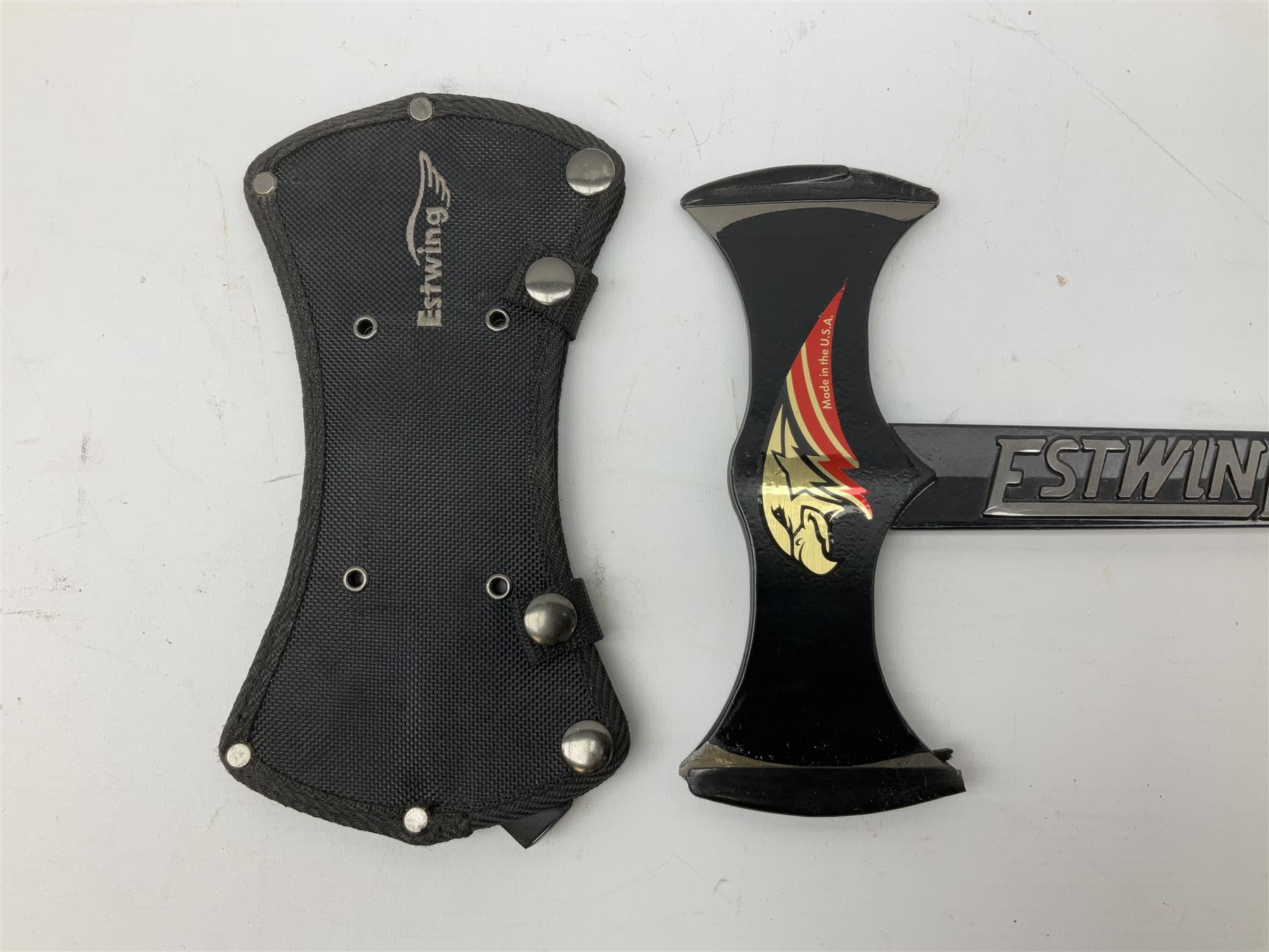 Estwing Black Eagle style double bit throwing axe with leather grip, virtually mint with labels present, plastic blade protectors and nylon sheath L43cm; another smaller Estwing axe stamped 24A to the pommel, with leather grip and sheath; and a vintage short handled hedge knife, the blade stamped IH (?) No.2 (3)