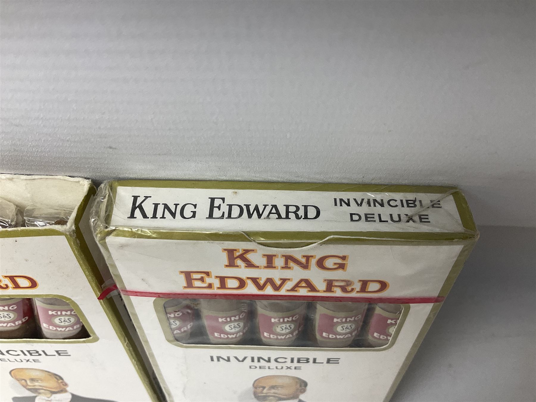 Two sealed packets of King Edward Invincible Deluxe Cigars and another three cigars 