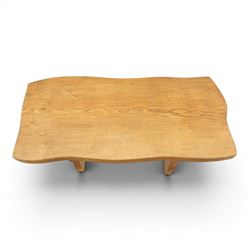 Acornman - rustic oak console table, shaped rectangular top, on shaped end supports, united by a stretcher with carved acorn signature, by the workshop of Alan Grainger, Brandsby