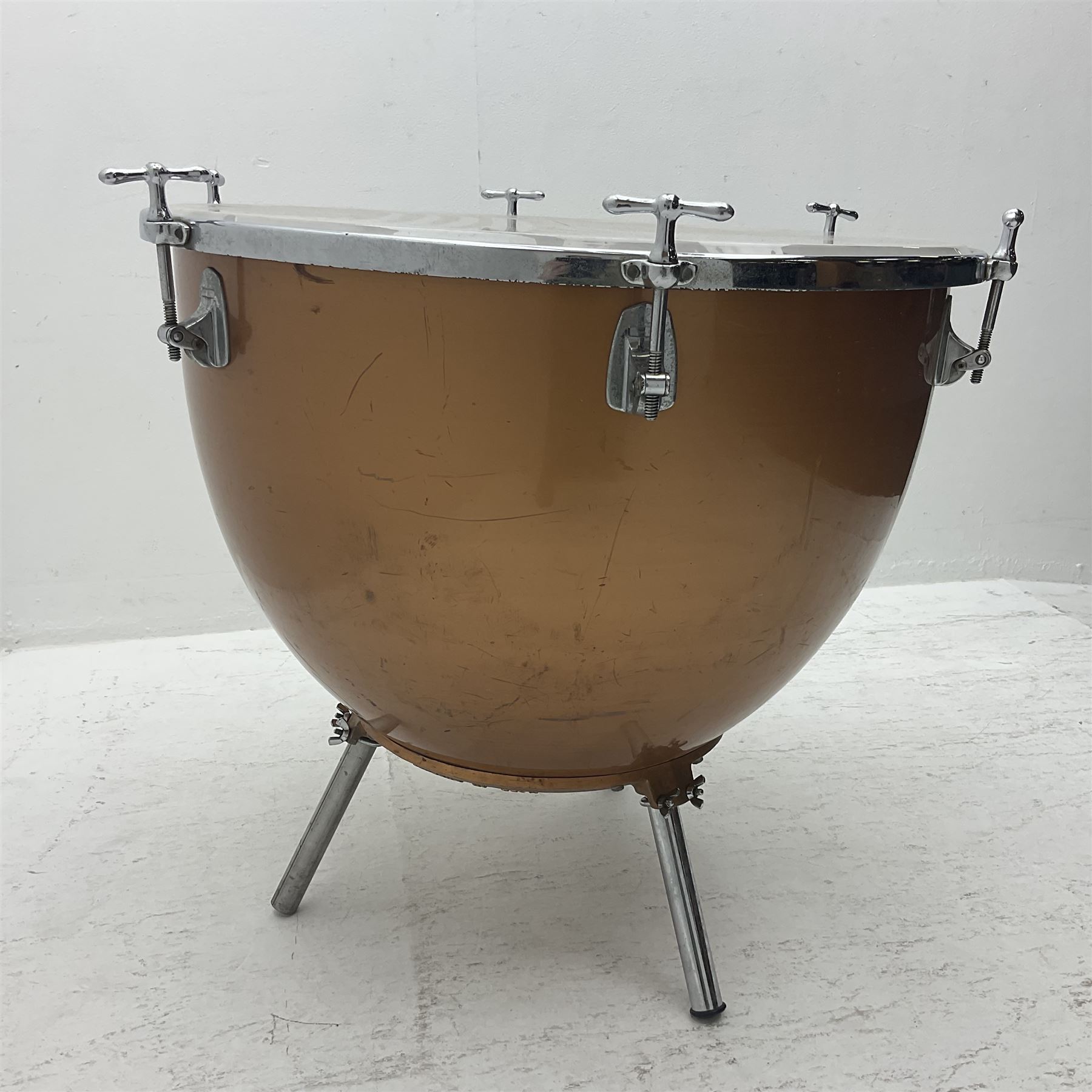 Timpani drum with coppered finish to the bowl, three adjustable tubular legs 'Marked Made in England 71 260' and Remo head D75cm 