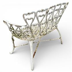 White cast metal garden bench in an antique style