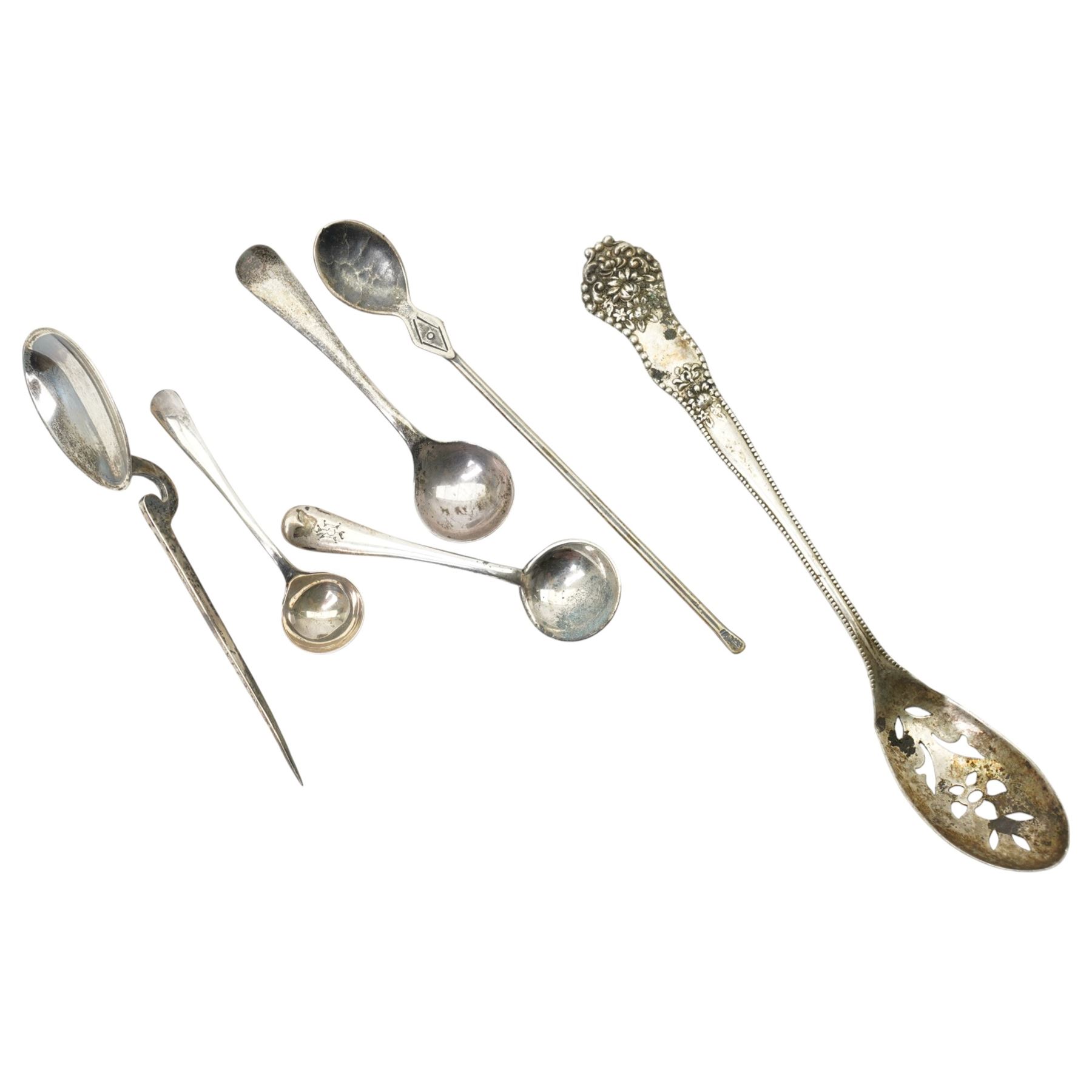 Two silver napkin rings, silver mirror frame and various silver spoons