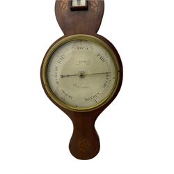 A William IV mercury wheel barometer c1830 with an inlaid broken pediment, brass finial and round base, mahogany veneered case with inlaid oval conch shell paterae and satinwood stringing to the edge, with a spirit thermometer, eight-inch silvered register reading barometric pressure in inches from 28  to 31, dial inscribed “I VERA, WARRENTED”, with a bevelled glass within a cast brass bezel, steel indicating hand and brass recording hand.




