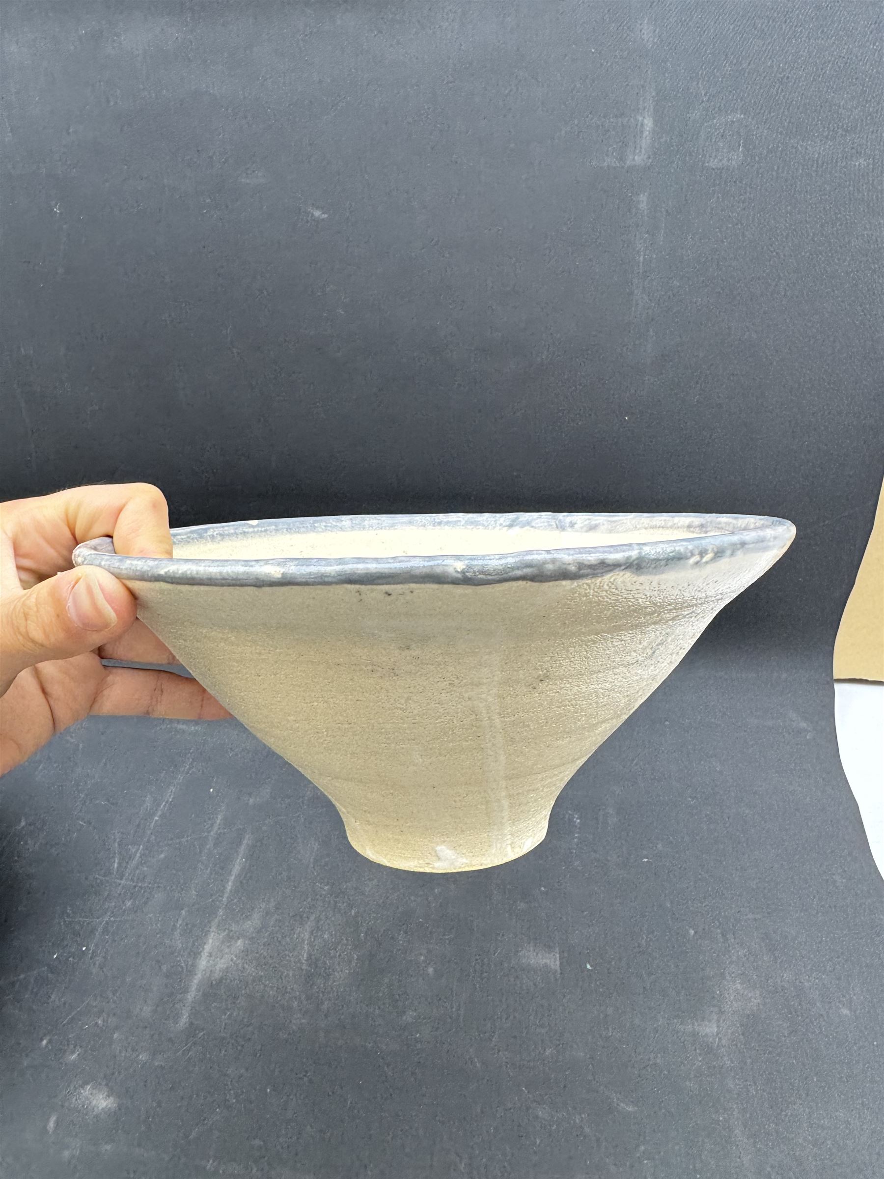 Studio pottery bowl of conical form, with blue band to the rim, together with Arwyn Jones dish, D20cm