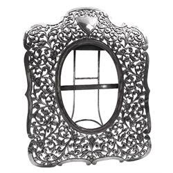 Continental silver photograph frame, probably Austrian, with pierced foliate and scroll decoration and vacant shield cartouche, H24.5cm, W19cm, approximate total weight 10.8 ozt (336.6 grams)