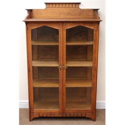  Early 20th century oak Arts and Crafts display cabinet, raised back, moulded top, two glazed doors enclosing three shelves, stile supports, W94cm, H155cm, D43cm   
