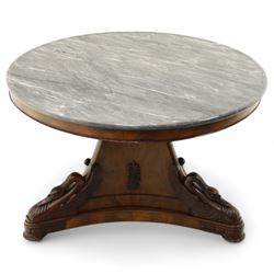 French mid-19th-century Second-Empire mahogany centre table with a dished grey-veined marble top, on a tapered triform pedestal with anthemion brass mounts above carved recumbent swan figures with delicately refined wings and graceful necks curving backwards, associated with the Empress Josephine, raised on three small platform bases