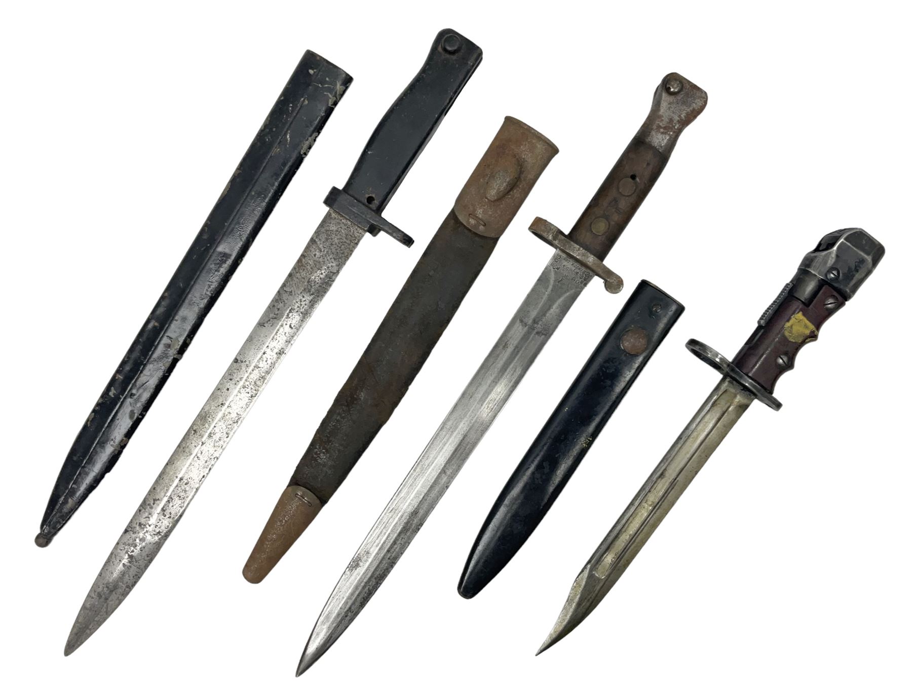 British No 7 MKI knife bayonet with 20cm single edged fullered clipped point blade;  blackened steel, large muzzle ring cross-guard; blackened swivelling pommel marked 'F5H'; red Tufnol composite grips; in blackened steel scabbard L33cm overall; British Pattern 1888 bayonet with scabbard; and German Ersatz bayonet with scabbard (3)