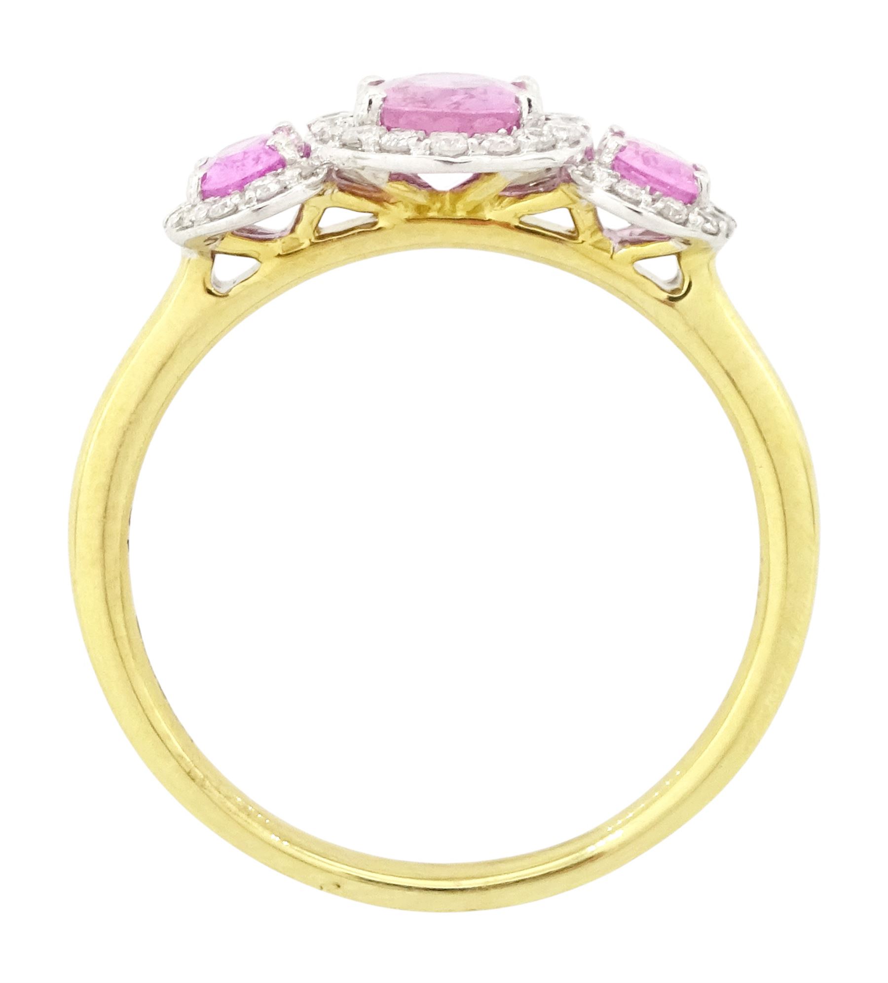 18ct gold pink sapphire and diamond trilogy ring, three oval cut sapphires surrounded by round brilliant cut diamonds, hallmarked, total sapphire weight approx 1.45 carat, total diamond weight approx 0.25 carat
