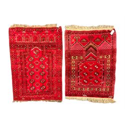 Afghan red ground prayer rug, the field decorated with stepped flat arch and Gul motifs (119cm x 80cm); together with a similar Afghan red ground prayer rug, with three pointed arches decorated with Gul motifs (108cm x 79cm)