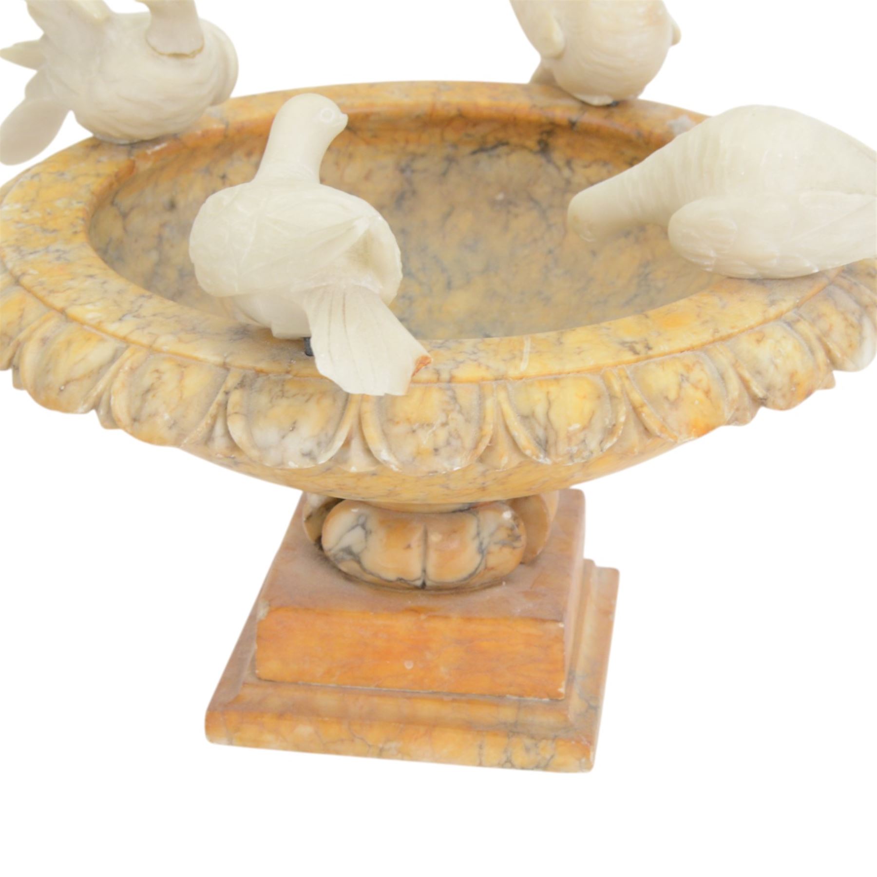 20th century alabaster bird bath, shallow bowl form with egg and dart moulded rim, mounted by four doves, H30cm, D35cm
